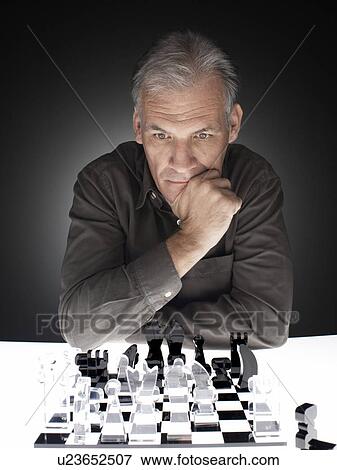 Man playing chess View Large Photo Image Stock Photo - Man playing chess. Fotosearch