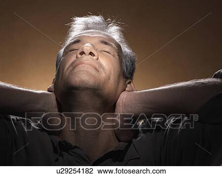 Man stretching with hands on neck View Large Photo Image Stock Image - Man stretching with hands on neck. Fotosearch