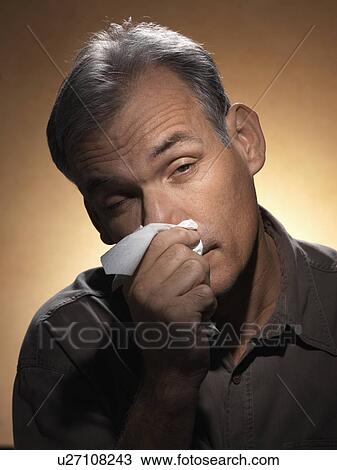 Mature man blowing nose View Large Photo Image Stock Image - Mature man blowing nose. Fotosearch