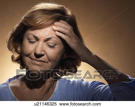 Stock Photography - Woman with headache. Fotosearch