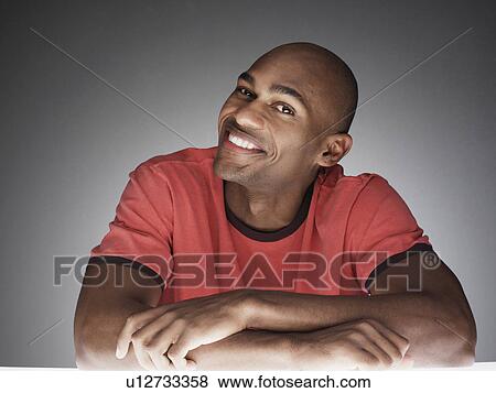 Stock Photo - Young man smiling (portrait). Fotosearch
