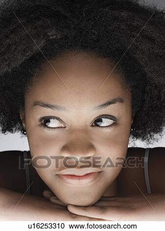 Young woman looking away (portrait) View Large Photo Image Stock Image - Young woman looking away (portrait). Fotosearch