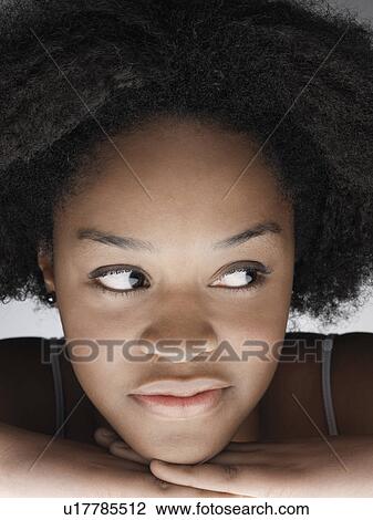 Young woman looking away (portrait) View Large Photo Image Stock Image - Young woman looking away (portrait). Fotosearch
