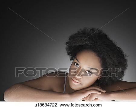 Young woman reclining (portrait) View Large Photo Image Stock Image - Young woman reclining (portrait). Fotosearch