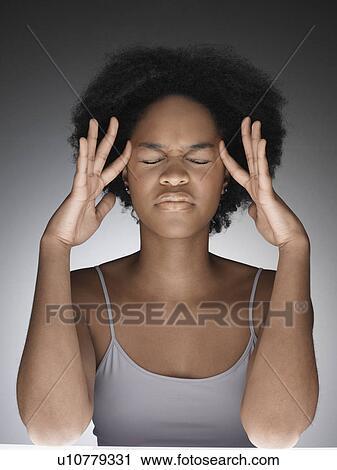 Young woman thinking with hands on face View Large Photo Image Stock Image - Young woman thinking with hands on face. Fotosearch