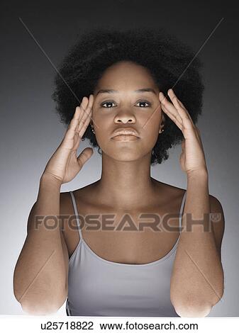 Young woman thinking with hands on face View Large Photo Image Stock Image - Young woman thinking with hands on face. Fotosearch