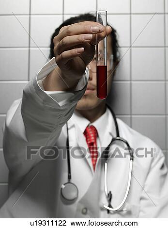 Doctor Looking at Test Tube View Large Photo Image Stock Image - Doctor Looking at Test Tube. Fotosearch