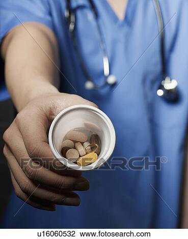Doctor Showing Pills View Large Photo Image Stock Image - Doctor Showing Pills. Fotosearch