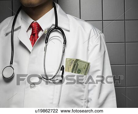 Stock Image - Doctor with Money in Pocket. Fotosearch