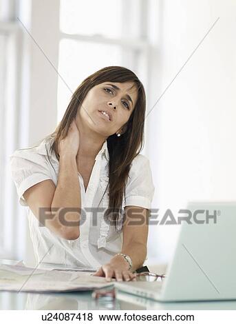 Stock Photo - Mid-Adult Woman Stretching Neck. Fotosearch