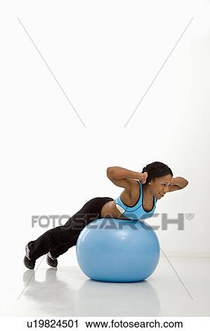 African American young adult woman working out with exercise ball. View Large Photo Image Stock Image - African American young adult woman working out with exercise ball.. Fotosearch