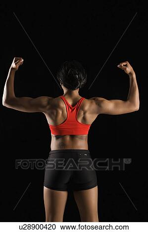 Back view of muscular African American woman with biceps flexed. View Large Photo Image Stock Image - Back view of muscular African American woman with biceps flexed.. Fotosearch