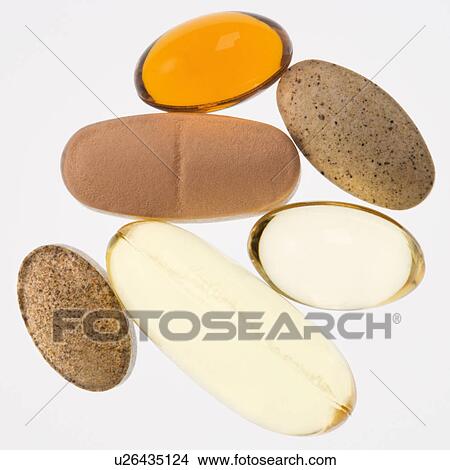 Close up of supplement vitamin pills against white background. View Large Photo Image Picture - Close up of supplement vitamin pills against white background.. Fotosearch