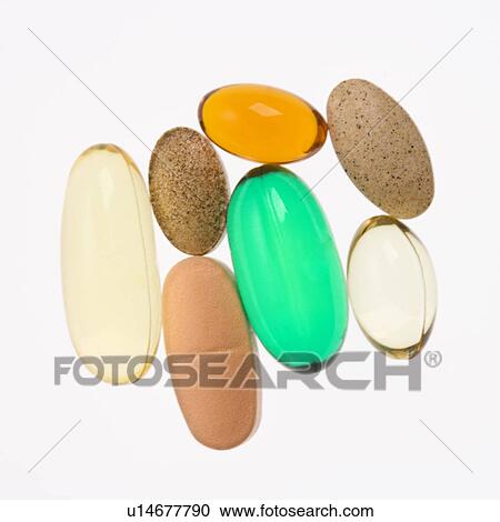 Close up of supplement vitamin pills against white background. View Large Photo Image Stock Image - Close up of supplement vitamin pills against white background.. Fotosearch