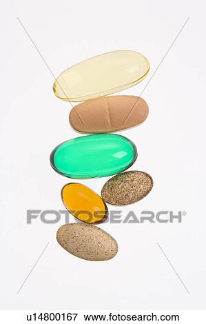 Close up of supplement vitamin pills against white background. View Large Photo Image Stock Photo - Close up of supplement vitamin pills against white background.. Fotosearch