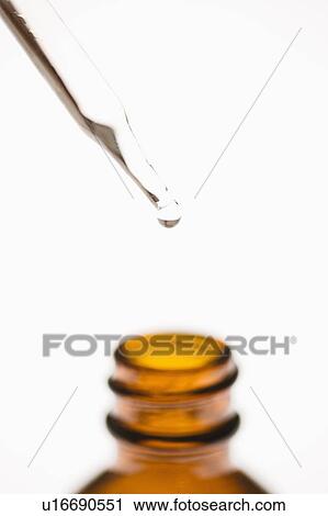 Dropper placed above brown bottle with white background. View Large Photo Image Stock Image - Dropper placed above brown bottle with white background.. Fotosearch