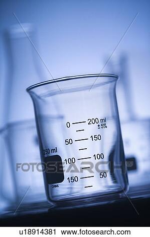 Stock Image - Glass science container with blue tint.. Fotosearch
