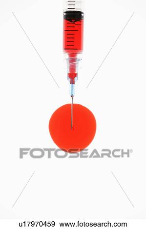 Hypodermic needle filled with red liquid. View Large Photo Image Stock Photo - Hypodermic needle filled with red liquid.. Fotosearch