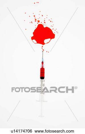 Stock Photograph - Hypodermic needle with red liquid sprayed on white background.. Fotosearch