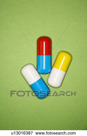 Medical pills on a green background. View Large Photo Image Stock Photo - Medical pills on a green background.. Fotosearch