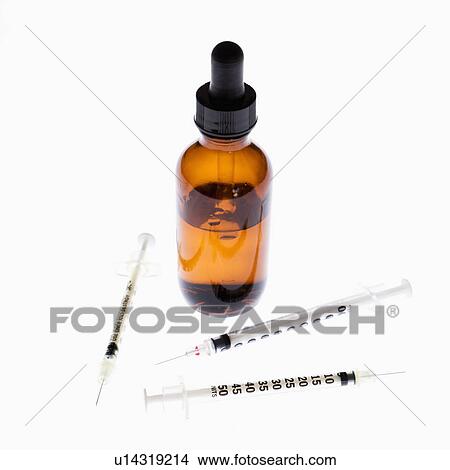 Three hypodermic needles beside dropper and bottle on white background. View Large Photo Image Picture - Three hypodermic needles beside dropper and bottle on white background.. Fotosearch