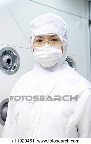 Portrait of a young scientist woman wearing protection suit in clean room, front view View Large Photo Image Stock Image - Portrait of a young scientist woman wearing protection suit in clean room, front view. Fotosearch