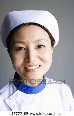 Portrait of a female nurse smiling View Large Photo Image Stock Photo - Portrait of a female nurse smiling. Fotosearch