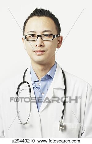 Stock Image - Portrait of a male doctor with a stethoscope around his neck. Fotosearch