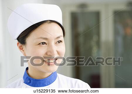 Close-up of a female nurse smiling View Large Photo Image Stock Photography - Close-up of a female nurse smiling. Fotosearch