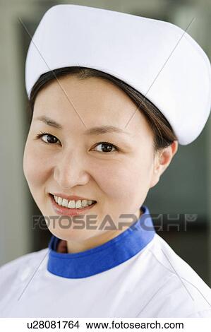 Portrait of a female nurse smiling View Large Photo Image Picture - Portrait of a female nurse smiling. Fotosearch