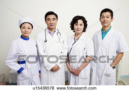 Stock Photo - Portrait of three doctors and a nurse. Fotosearch