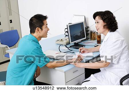 Side profile of a female doctor taking a patient's pulse View Large Photo Image Stock Image - Side profile of a female doctor taking a patient's pulse. Fotosearch
