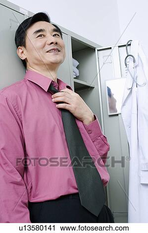 Close-up of a doctor smiling View Large Photo Image Stock Image - Close-up of a doctor smiling. Fotosearch