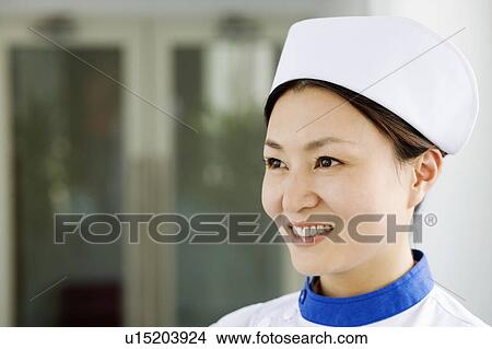 Close-up of a female nurse smiling View Large Photo Image Picture - Close-up of a female nurse smiling. Fotosearch