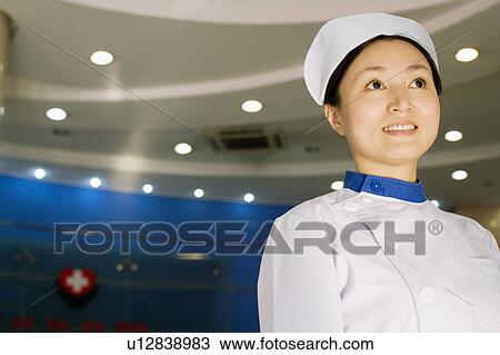 Stock Image - Close-up of a female nurse smiling. Fotosearch