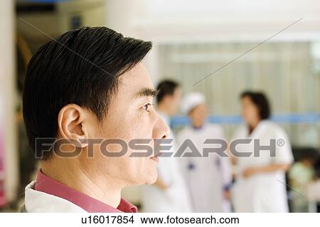 Side profile of a doctor View Large Photo Image Picture - Side profile of a doctor. Fotosearch