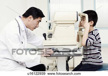 Side profile of an optometrist examining a patient View Large Photo Image Stock Photo - Side profile of an optometrist examining a patient. Fotosearch