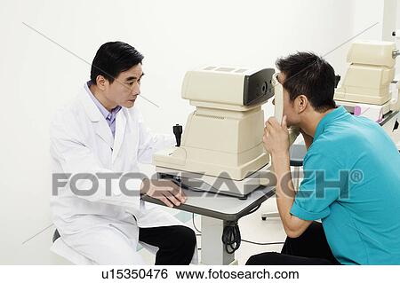 Side profile of an optometrist examining a patient View Large Photo Image Stock Photograph - Side profile of an optometrist examining a patient. Fotosearch