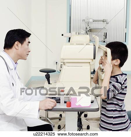 Side profile of an optometrist examining a patient View Large Photo Image Stock Photography - Side profile of an optometrist examining a patient. Fotosearch