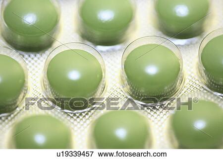 Stock Photo - capsules, close-up, formula, germany, green, health, healthy. Fotosearch