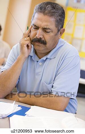 Adult student in class thinking View Large Photo Image Stock Image - Adult student in class thinking. Fotosearch