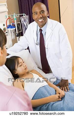Doctor Standing In Hospital Room With Patient View Large Photo Image Stock Image - Doctor Standing In Hospital Room With Patient. Fotosearch