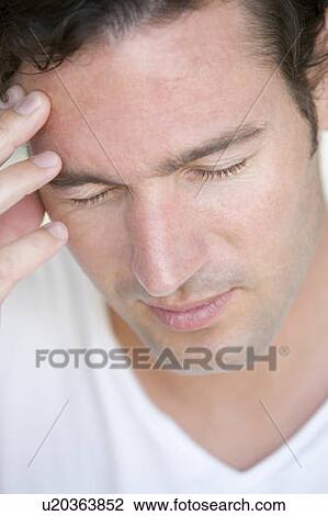 Head shot of man scowling View Large Photo Image Stock Image - Head shot of man scowling. Fotosearch