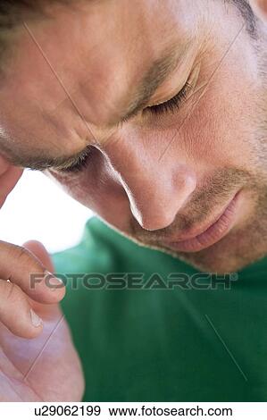 Head shot of man scowling View Large Photo Image Stock Photo - Head shot of man scowling. Fotosearch