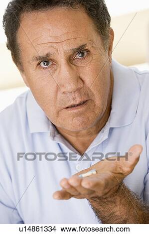 Man Taking Pills View Large Photo Image Picture - Man Taking Pills. Fotosearch