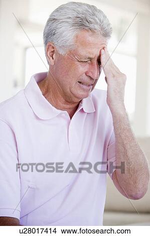 Picture - Man With A Headache. Fotosearch