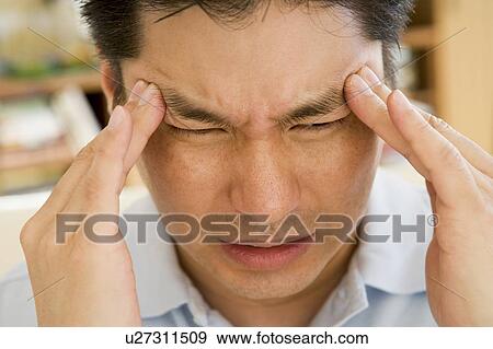 Stock Photo - Man With A Headache. Fotosearch