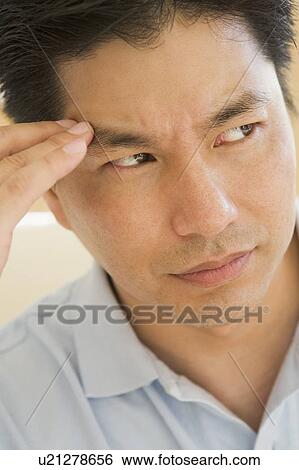 Stock Photograph - Man With A Headache. Fotosearch