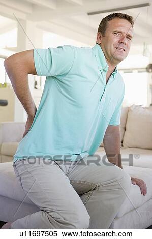 Man With Back Pain View Large Photo Image Stock Photography - Man With Back Pain. Fotosearch