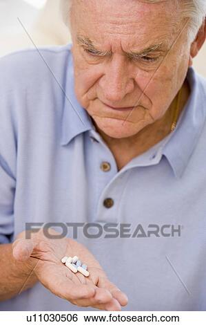 Senior Man Looking At Medicine View Large Photo Image Stock Photograph - Senior Man Looking At Medicine. Fotosearch